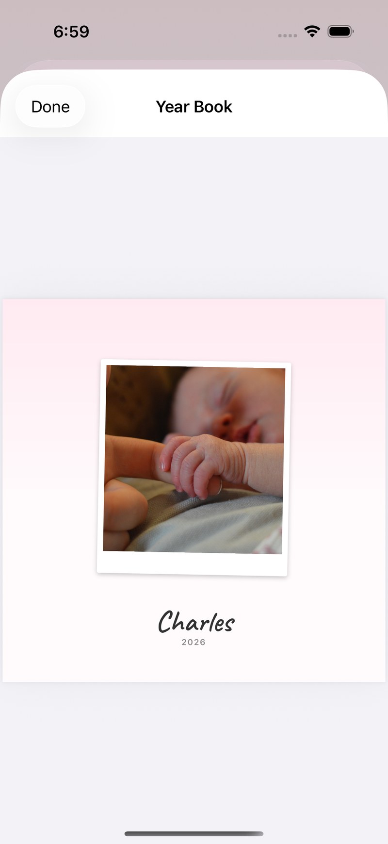 The Year Book's cover page: a polaroid of a sleeping newborn above the child's name, set in a book